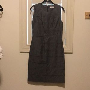 Layered sheath dress with a dark denim fabric